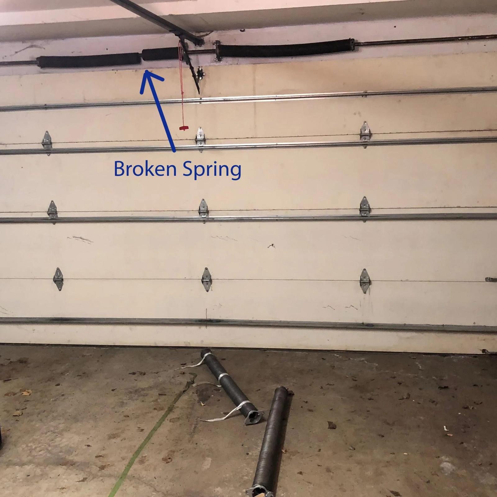 Broken garage door torsion spring after failure in El Paso home